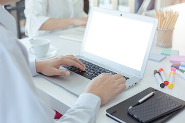 Close up hand of business people working with computer laptop blank white screen in meeting table. Empty display computer laptop.