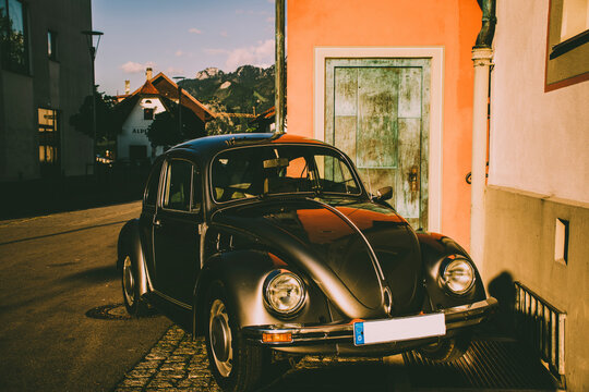 F√úSSEN, GERMANY 26 May 2019 - Tidy and shiny looking retro car Beetle parked at the street. n