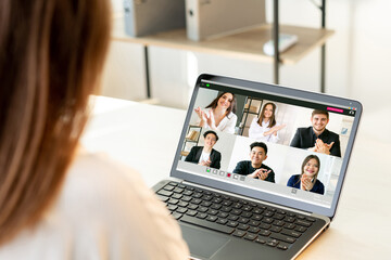 Video conference. Business webinar. Distance teamwork. Pandemic WFH. Supportive diverse multiracial corporate team encouraging colleague on laptop at light modern home office workplace. - obrazy, fototapety, plakaty