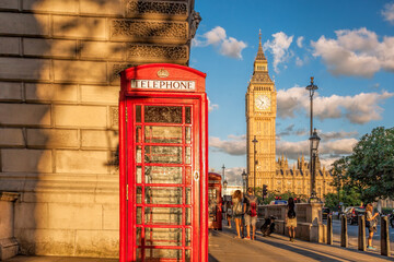 Big Ben with red phone booth in London, England, UK