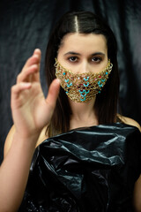 Pandemic fashion. Quarantine accessory. Fancy dress party. New normal. Mysterious woman in luxury...