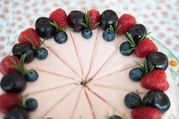 Naklejka na ściany i meble Set of cake cream rose decoration with fresh raspberries and fresh berries slices.