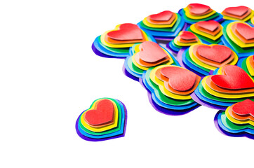 Colorful lgbt Valentine's day background - rainbow hearts isolated on white, border, top view.
