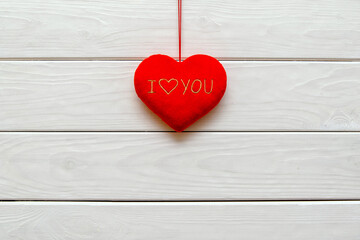 A symbol of love on white wooden background
