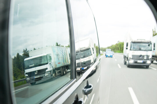 Reflection Of Truck On Window Of Car