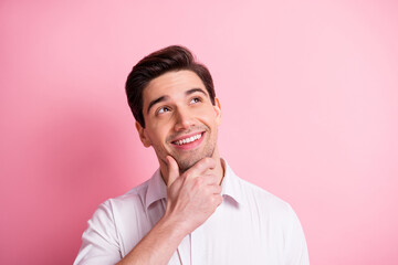 Portrait of satisfied person arm on chin look empty space thinking isolated on pink color background