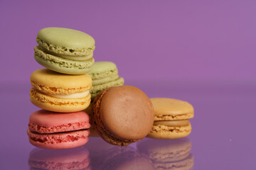 Colorful french macarons on background