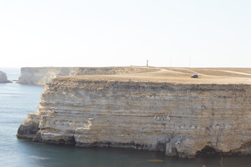 steep edge of a flat hill overlooking the sea