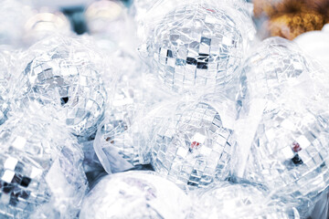 A lot of Christmas disco balls close up in supermarket