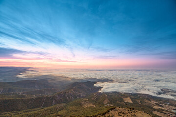 sunrise on the coast in clouds and mountains