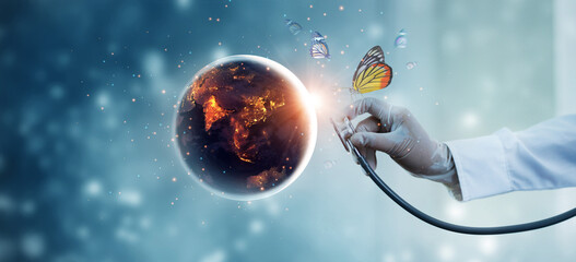 Earth at night being with butterfly checked by a doctor with a stethoscope. Environment and...