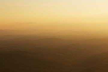 background of mountains in yellow light