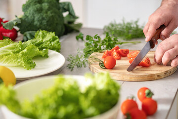 Man hands preparing delicious and healthy lunch at home kitchen