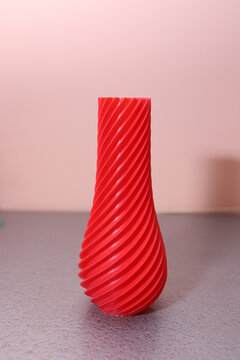 red vase, printed on a 3D printer. 3D printing