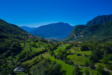 Trentino Alto Adige region, Italy. Aerial view. Alps Lake Garda and the city of Riva del Garda, Italy. Perfect blue sky. Rock in the background the city of Riva del Garda, Italy.