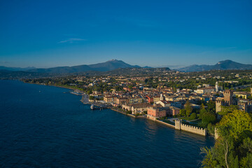 Naklejka na ściany i meble Panoramic aerial view of the Scaligero Castle of Lazise. Italian resort on Lake Garda top view. Lazise town, lake garda, Italy.