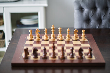 Luxury chess set. Chess pieces on the wood board.