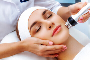 Photo vacuum rf face lifting. Biostimulation in a beauty salon. Skin rejuvenation. Radio wave lifting.