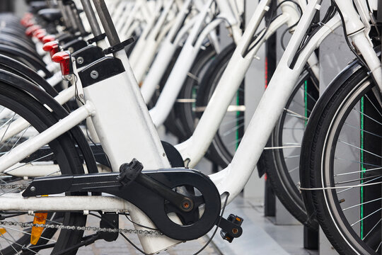 Urban electric bikes charging batteries in the city. Transportation