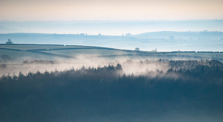 Stunning foggy and frosty sunrise landscape at Haddon Hill, Exmoor national park, Devon, UK