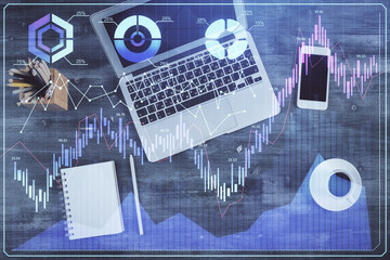 Double exposure of forex chart drawing over table background with computer. Concept of financial research and analysis. Top view.