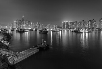 Fototapeta na wymiar Night scenery of harbor and skyline of Hong Kong city