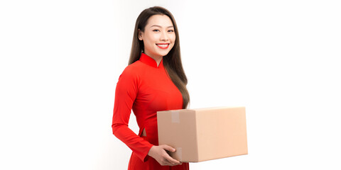 Woman in vietnamese traditional clothes giving gift box