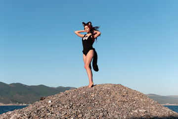cat-tail girl on the beach