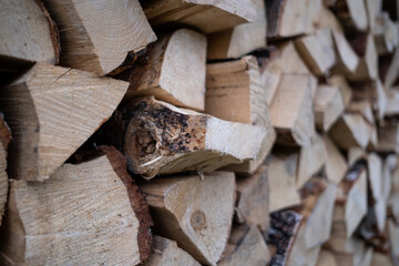 Woodpile with fireplace wood stacked. alternative, renewable energy