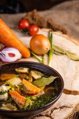 Fresh fish soup with ingredients and spices for cooking. Salmon soup.  Clean eating, healthy and diet food concep