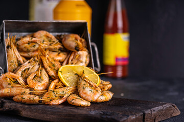 Fried shrimps with garlic, spices and lemon. Grilled shrimps. Delicious scene.