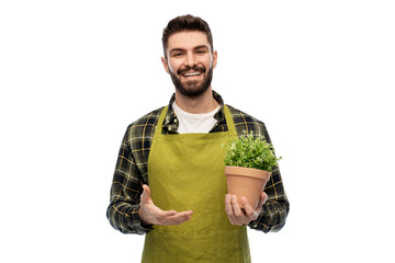 gardening, floristry and people concept - happy smiling male gardener in apron with flower in pot...