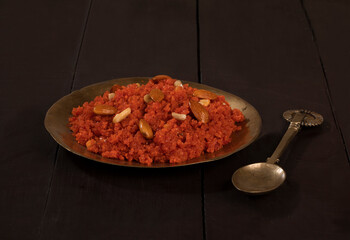 Indian Special Famous Winter Sweet Food Carrot Halwa or Gajar ka Halwa Served With Kesar Masala Milk 