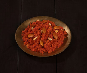 Indian Special Famous Winter Sweet Food Carrot Halwa or Gajar ka Halwa Served With Kesar Masala Milk  - obrazy, fototapety, plakaty