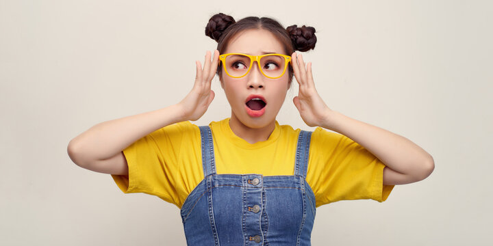 Wow! I Don't Believe You! Close Up Portrait Of Shocked Astonished Woman With Open Mouth And Big Eyes, She Is Touching Her Glasses