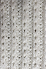 Knitted wool fabric. Background. Manufactory