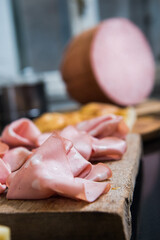 Mortadella Bologna is a large Italian sausage made with cooked pork, mixed with cubes of...