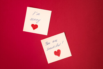 Sticker with love words written by pen, drawn heart and compliments for valentine s day  at red...