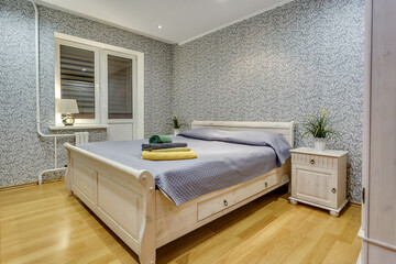 Interior of the modern luxure bedroom in studio apartments in light color style