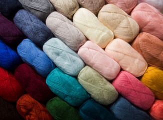 The cotton threads for yarn of different colors as a background
