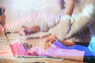 Multi exposure of woman hands typing on computer and financial chart hologram drawing. Stock market analysis concept.