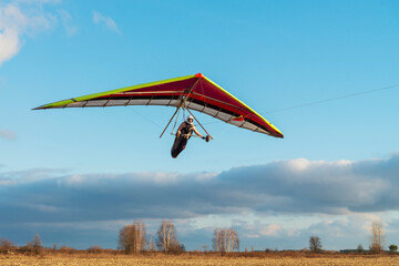 Girl student is mastering hang gliding sport. - 404796047