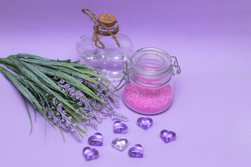 Obraz na płótnie Canvas Jars and a bouquet of lavender - preparation for spa treatments, body care. The photo
