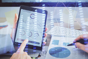 Multi exposure of man's hands holding and using a phone and financial chart drawing. Market analysis concept.