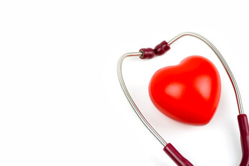 Red heart with stethoscope on white background. Selective focus.Health and Medical concept.	
