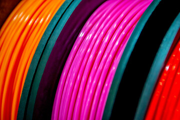 Multicolored filaments of plastic for printing on 3D printer close-up - obrazy, fototapety, plakaty