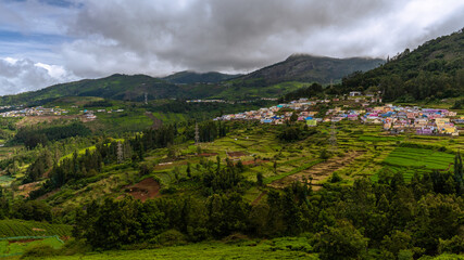 ooty village of  green mountains landscape with sky and clouds . Ooty or Ootacamund or Udhagamandalam is a popular hill station in India