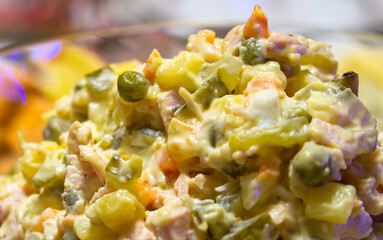 Olivier Salad. Russian salad with variable ingredients, made with chopped vegetables, meat, and mayonnaise.