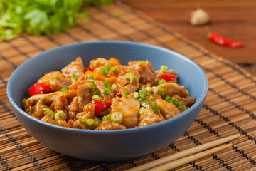 Chicken kung pao. Fried chicken pieces with peanuts and peppers.