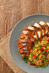 Grilled chicken breast in teriyaki sauce. Served with brown rice and vegetables.